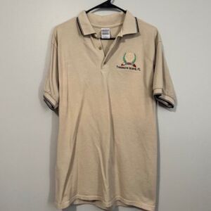USED Men's Gildan Shirt Sleeve Polo Treasure Island FL. Shirt Color Tan Size Med